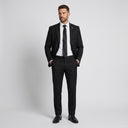 Jackson 1 Button Jacket - Black | Place the product on to a male model standing in a studio on a light grey background.