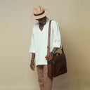Man wearing brown trilby hat
