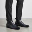 Brooklyn Zip Boot | Professional eCommerce fashion photography of men's formal leather boots being worn by a male model.