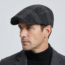 Dupplin Argyle Flat Cap Corduroy black/charcoal | Place this hat on the head of a male. The image should be taken in a studio setting on a light grey backround.