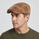 Dupplin Argyle Flat Cap Corduroy brown/tan | Place this hat on the head of a male. The image should be taken in a studio setting on a light grey backround.