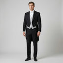 Heston Ogl Tails Jacket Black | Place the product on to a male model standing in a studio on a light grey background.