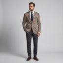 Isaac Stretch Jersey Sports Jacket - Biscuit | Place the product on to a male model standing in a studio on a light grey background.
