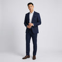 Isaac Stretch Jersey Sports Jacket - Indigo | Place the product on to a male model standing in a studio on a light grey background.