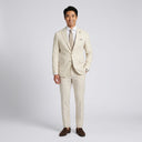 Matteo Notch Lapel Wool Blend With Stretch Jacket Oatmeal | Place the product on to a male model standing in a studio on a light grey background.