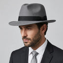 Men's Felt Fedora Hat GREY | Place this hat on the head of a male. The image should be taken in a studio setting on a light grey backround.