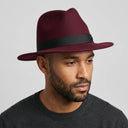Men's Felt Fedora Hat WINE | Place this hat on the head of a male. The image should be taken in a studio setting on a light grey backround.