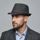 Men's Summer Trilby DENIM BLACK | Place this hat on the head of a male. The image should be taken in a studio setting on a light grey backround.