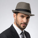 Men's Winter Trilby Chevron brown | Place this hat on the head of a male. The image should be taken in a studio setting on a light grey backround.