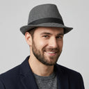 Men's Winter Trilby Chevron charcoal | Place this hat on the head of a male. The image should be taken in a studio setting on a light grey backround.
