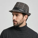 Men's Winter Trilby Dupplin black/brown | Place this hat on the head of a male. The image should be taken in a studio setting on a light grey backround.