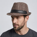 Men's Winter Trilby Dupplin brown/red | Place this hat on the head of a male. The image should be taken in a studio setting on a light grey backround.