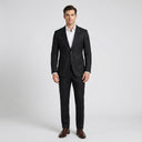 Oscar Pure Wool Jacket Charcoal | Place the product on to a male model standing in a studio on a light grey background.