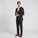 Oscar Pure Wool Jacket Charcoal | Same again, but the model is now standing in a completely different pose.