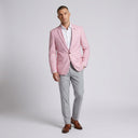 Quinn Mens Jacket Pink (56) | Place the product on to a male model standing in a studio on a light grey background.