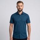 Short Sleeve Shirt TEAL | Man wearing this short sleeve shirt. Have the man standing in front of a light grey backround, showing from the waist up.