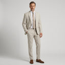 Stallone Plain Weave Stretch Jacket Sand | Place the product on to a male model standing in a studio on a light grey background.