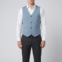 Stallone Plain Weave Stretch Vest SKY | A man wearing this vest. He should be standing on a light grey studio background.