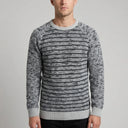Striped Wool Crew Pullover - Charcoal | Man wearing this casual pullover. Have the man standing in front of a light grey backround, showing from the waist up.