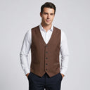 Theo Men's Vest Brown | A man wearing this vest. He should be standing on a light grey studio background.